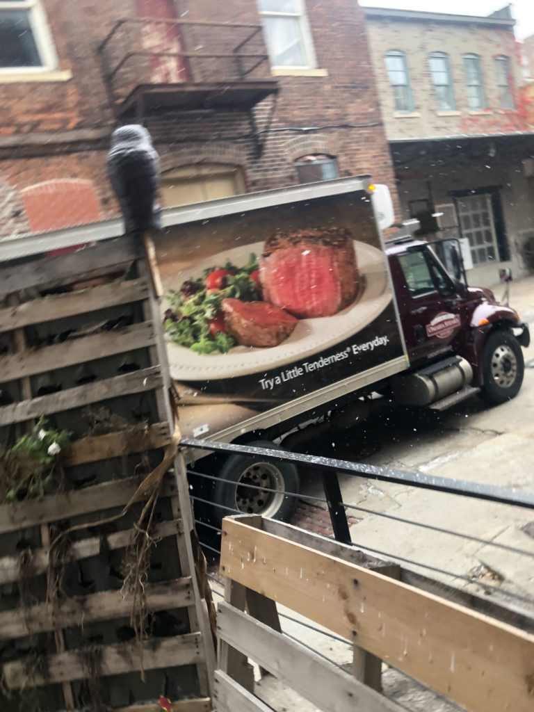 Omaha Steaks truck with text "Try a Little Tenderness Everyday"